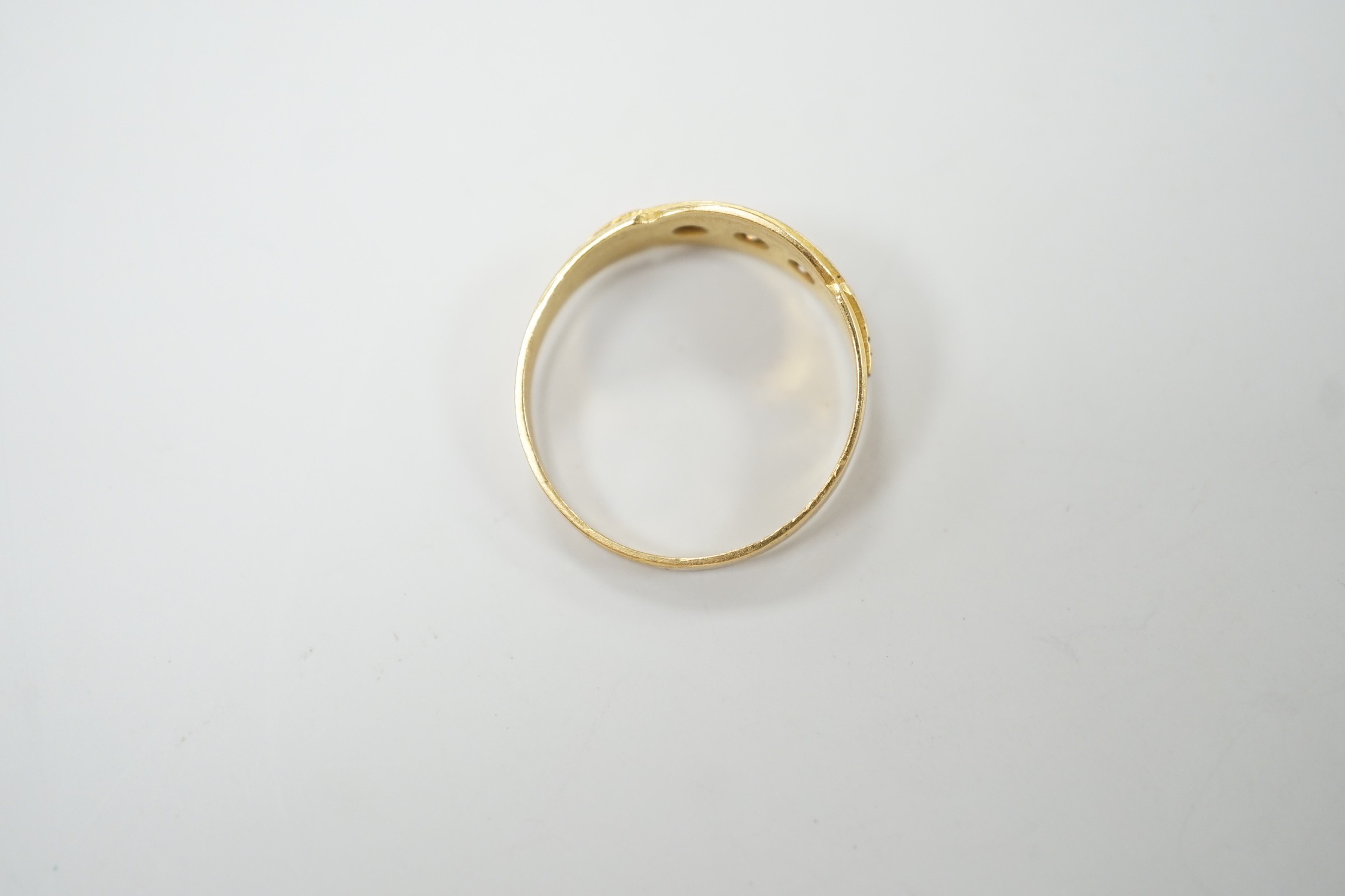A late Victorian 18ct gold and gypsy set three stone diamond ring, size Q, gross weight 2.8 grams.